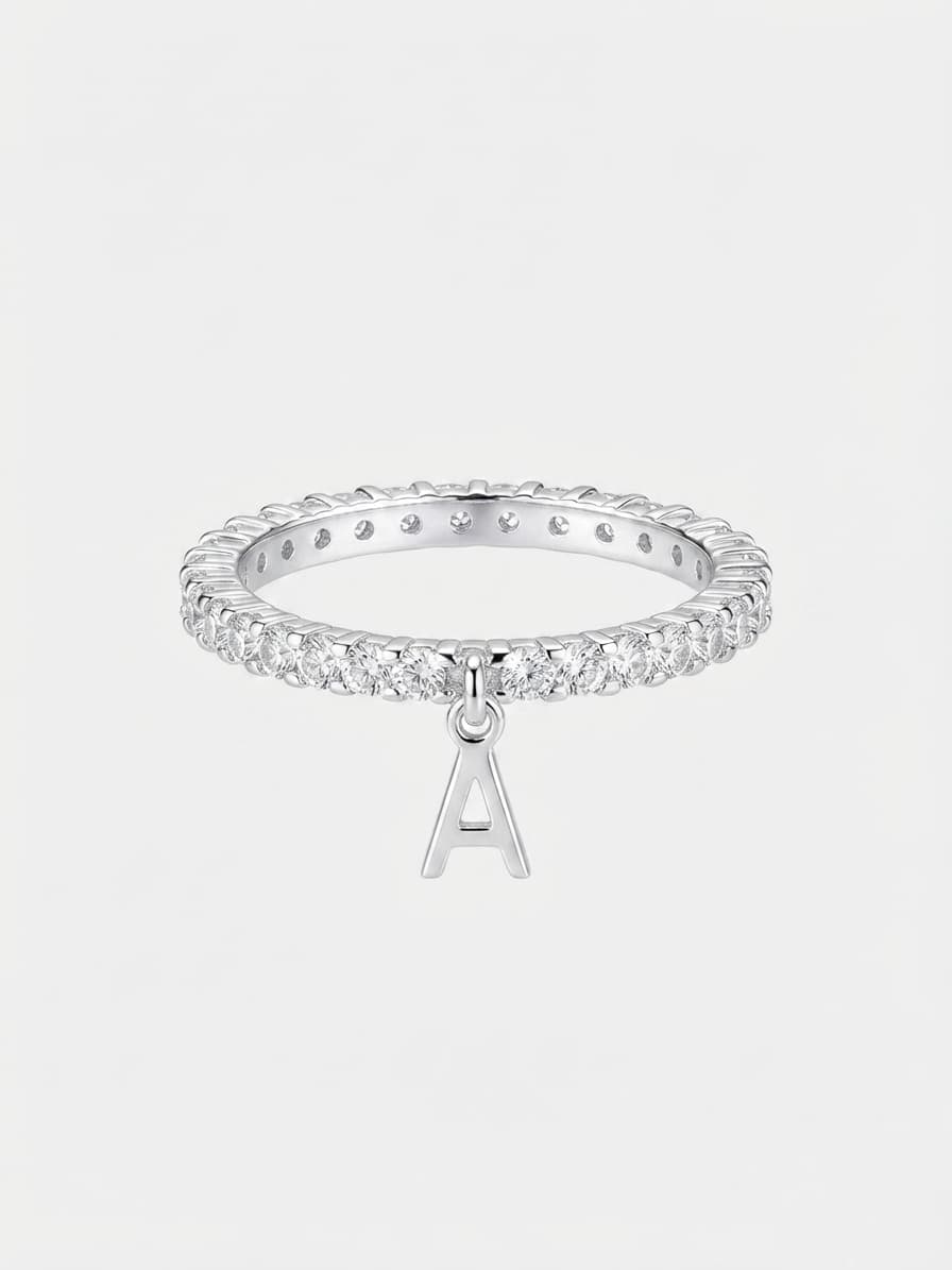 Silver ring with a letter charm