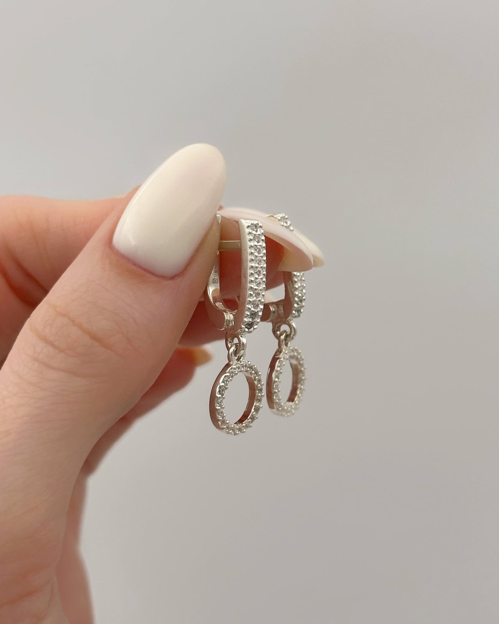 Silver earrings with circle drops and cubic zirconia