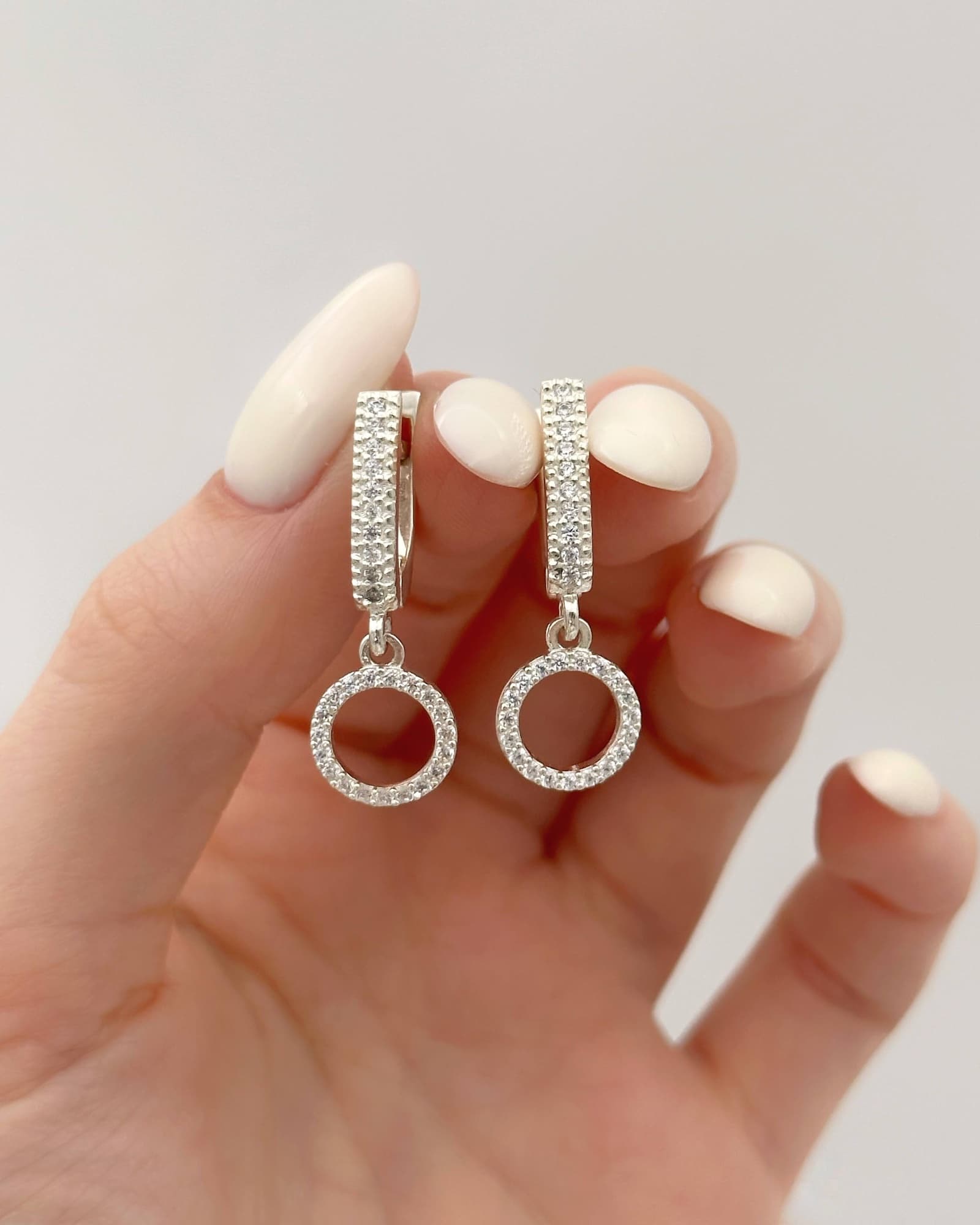 Silver earrings with circle drops and cubic zirconia