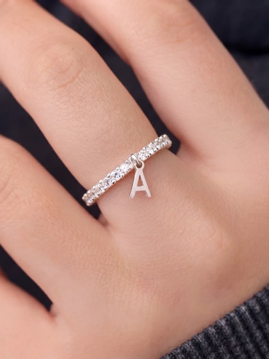 Silver ring with a letter charm