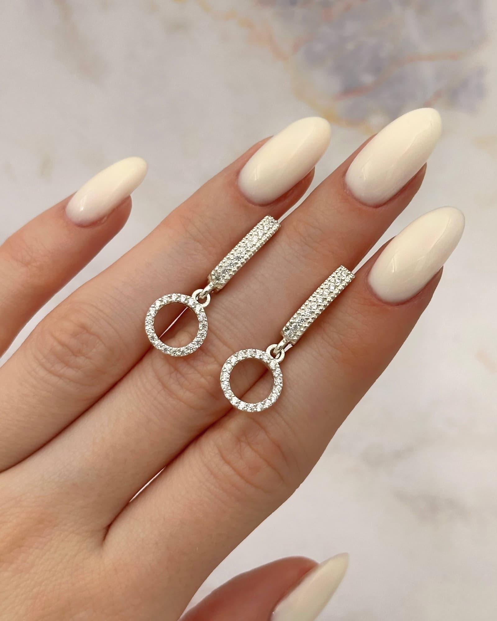 Silver earrings with circle drops and cubic zirconia