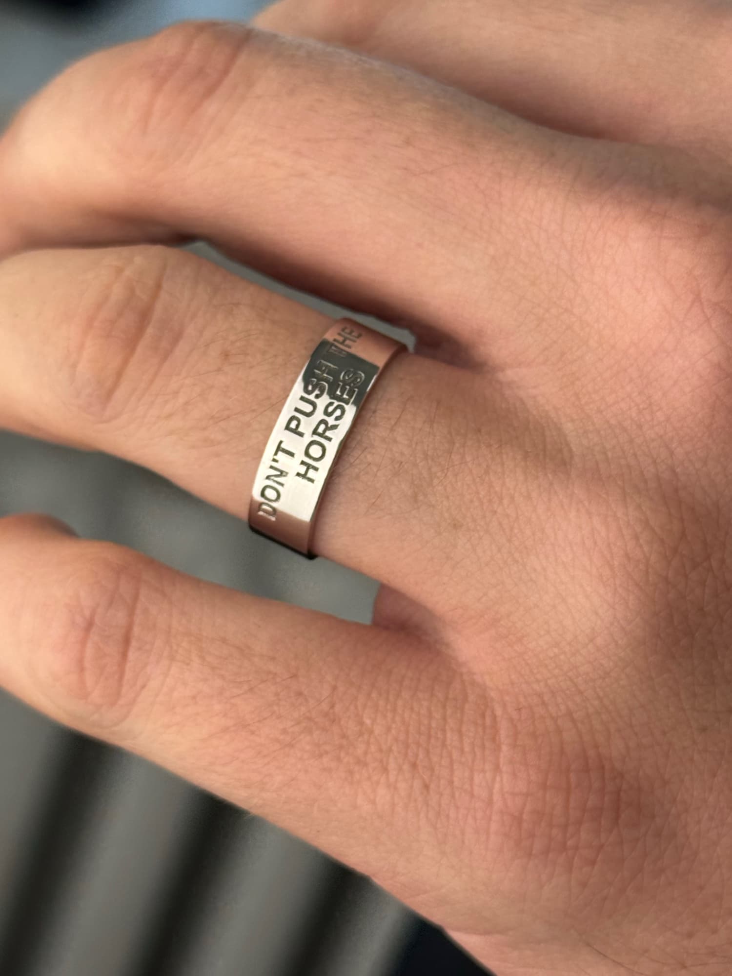 Wide men's silver ring engraved “Don't push the horses”