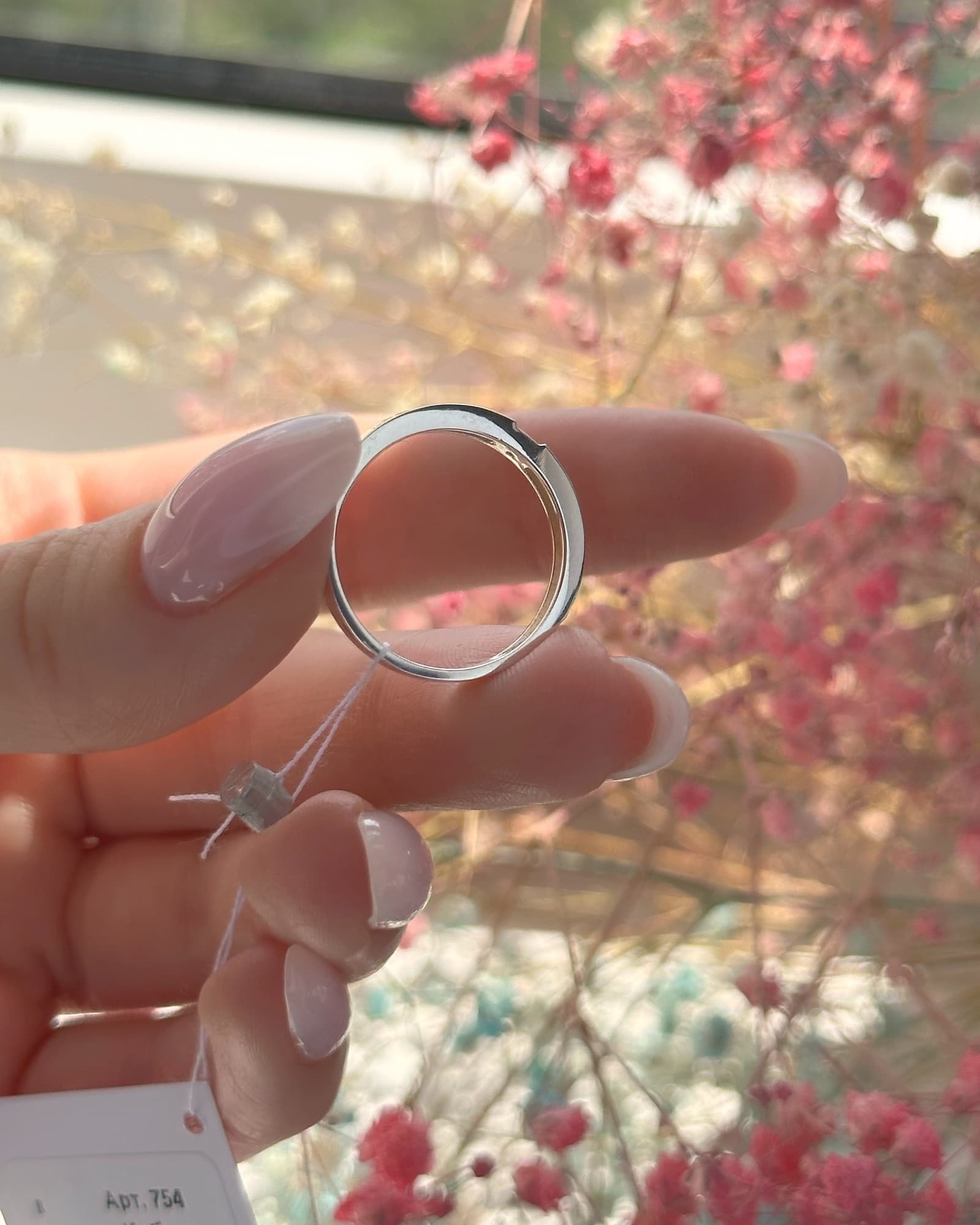 Silver ring with a 375 gold plate around the band and a cubic zirconia