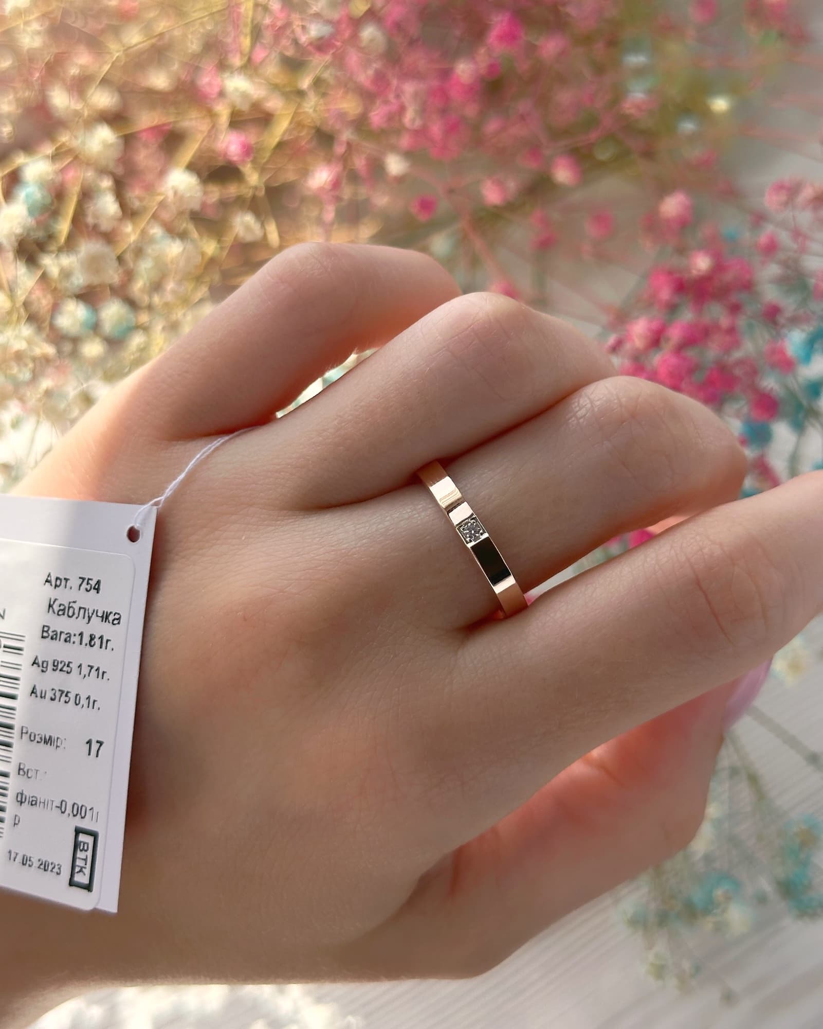 Silver ring with a 375 gold plate around the band and a cubic zirconia