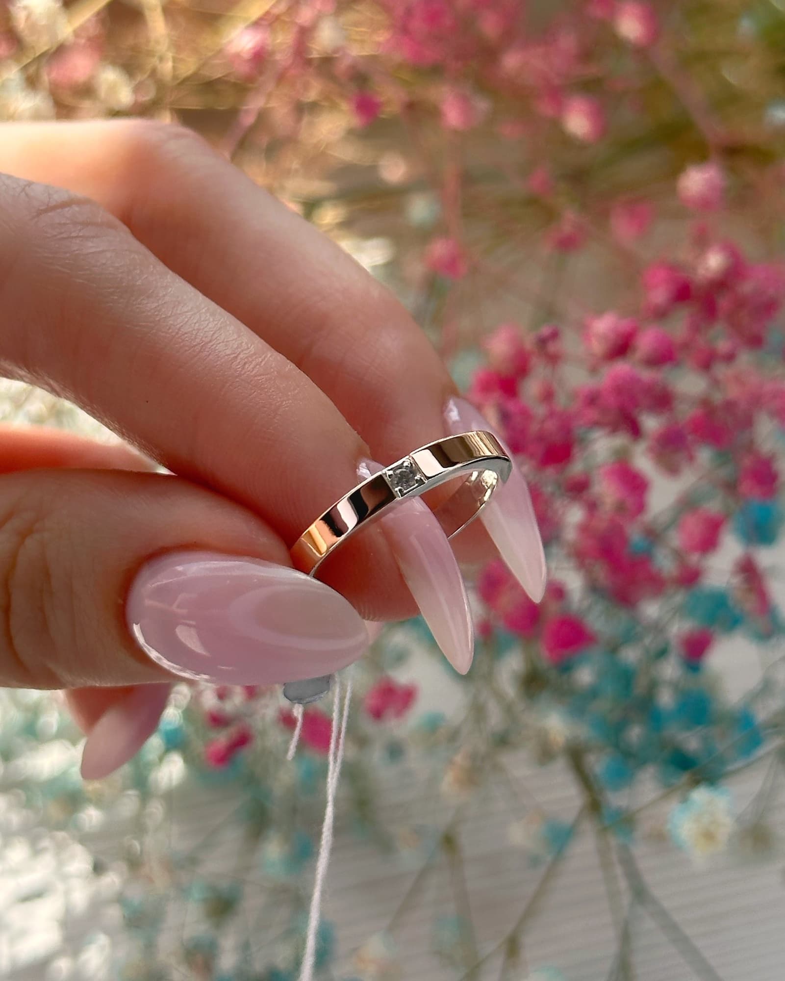 Silver ring with a 375 gold plate around the band and a cubic zirconia