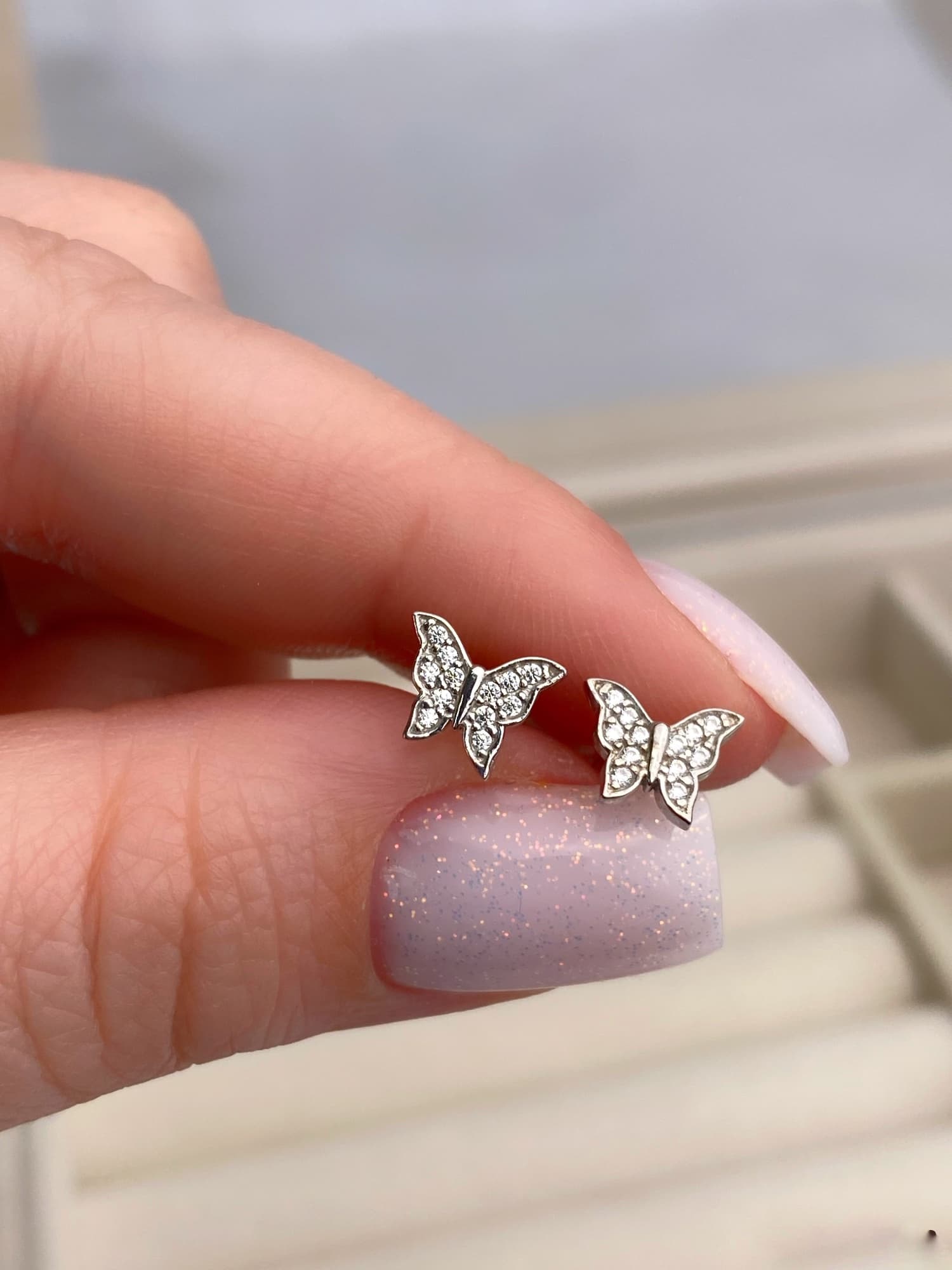 Rhodium-plated silver butterfly stud earrings with cubic zirconia