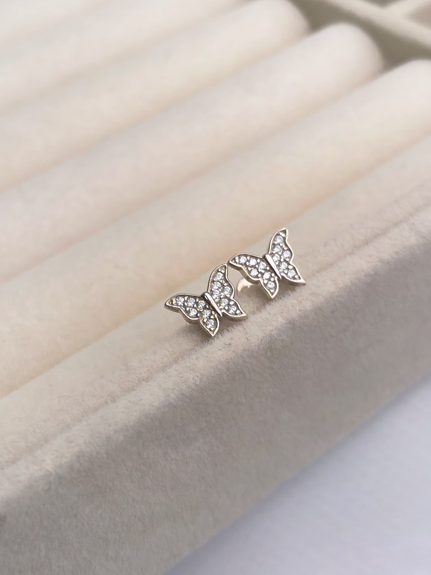 Rhodium-plated silver butterfly stud earrings with cubic zirconia