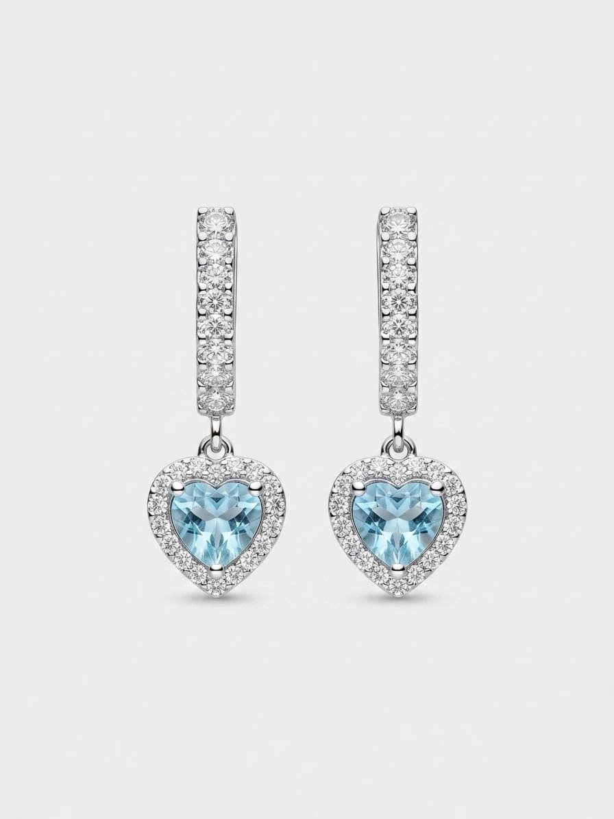 Silver “Hearts” earrings on an English lock with a light blue heart-shaped cubic zirconia
