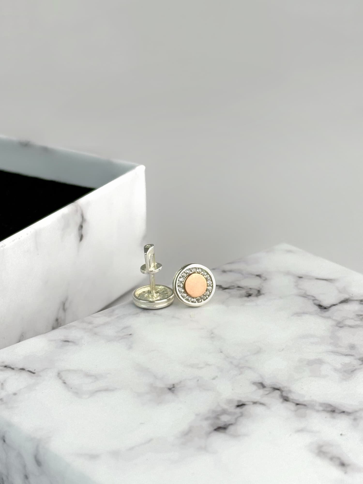 Silver screw-back earrings with a gold plate and cubic zirconia