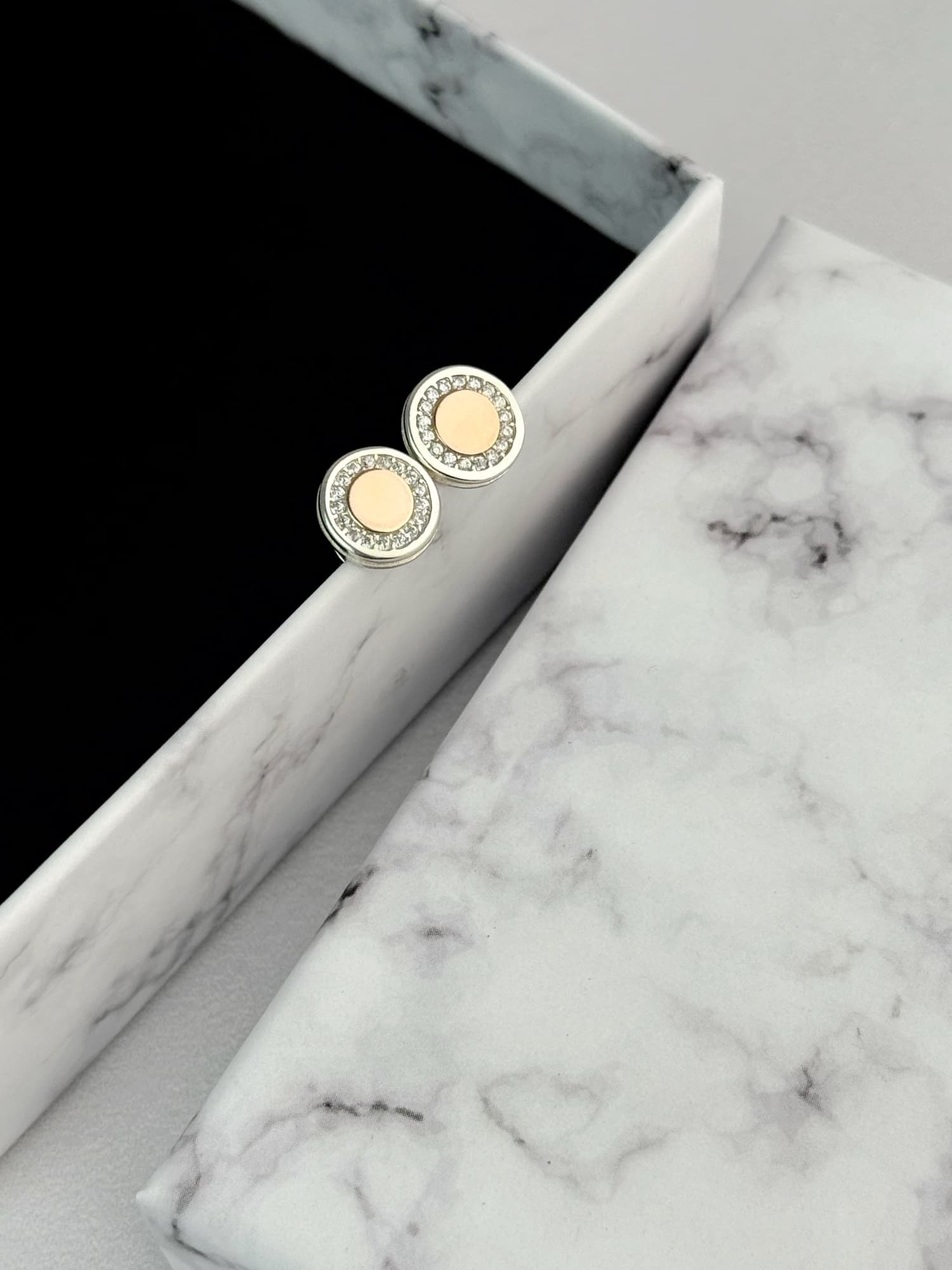 Silver screw-back earrings with a gold plate and cubic zirconia